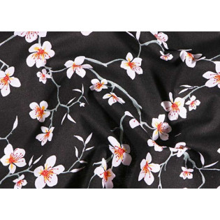 Tissu 100% coton fleurs d'amandier sur fond noir 150 cm de large